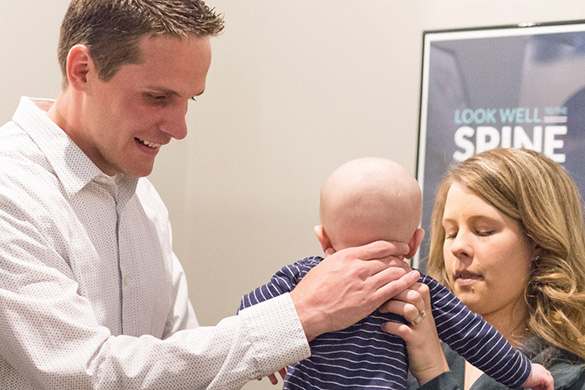 Chiropractor Green Bay WI Matthew Filtz with Pediatric Patient